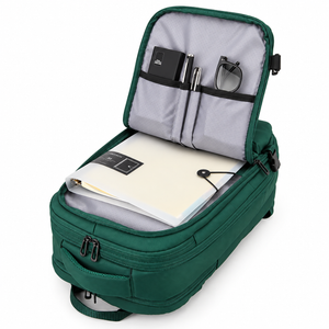 Green travel backpack opened flat showing organiser pockets and padded laptop compartment