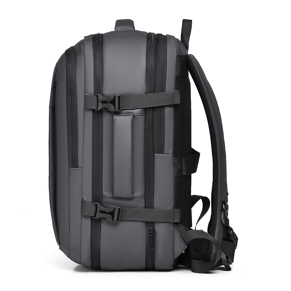 Side view of the grey 40L backpack showing compression straps and side handle