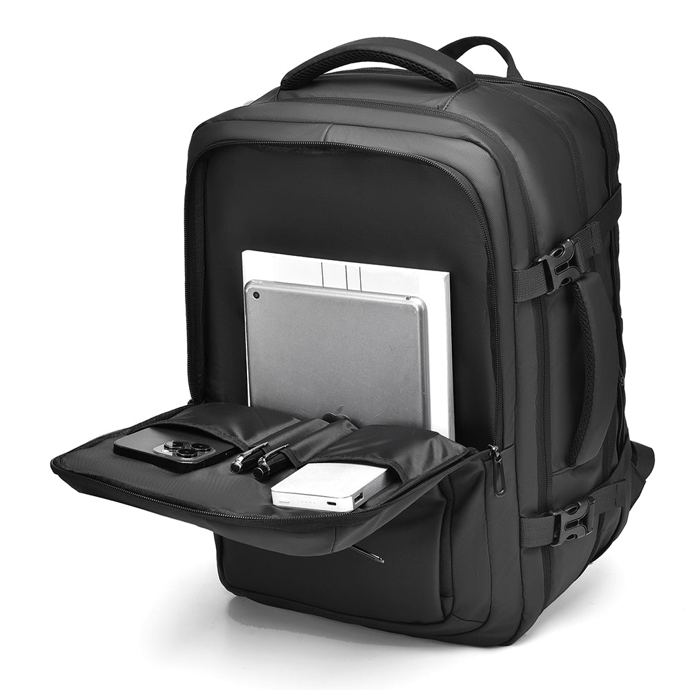 Grey backpack front pocket folded down with laptop, tablet and accessories organiser