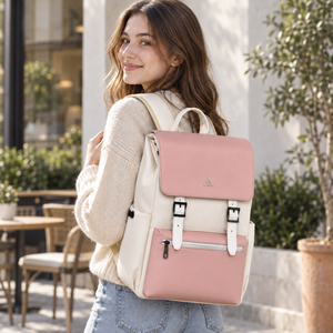 Woman wearing the pink and cream magnetic flap laptop backpack outdoors